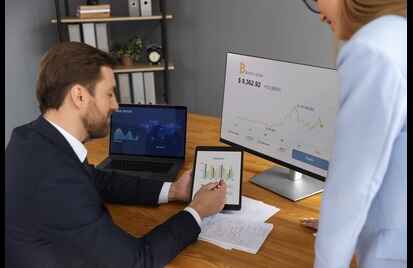 person looking finance graphs 3 1