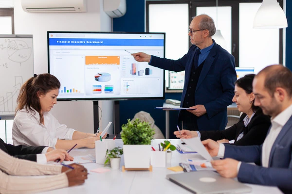 senior team leader explaining presentation discussion conference room briefing planning 1