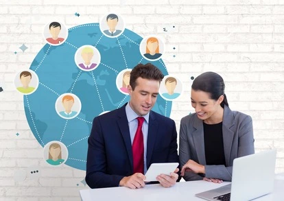 happy business people desk looking tablet against white wall with graphics 1