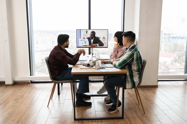 group coworkers video conference meeting modern office 1 1